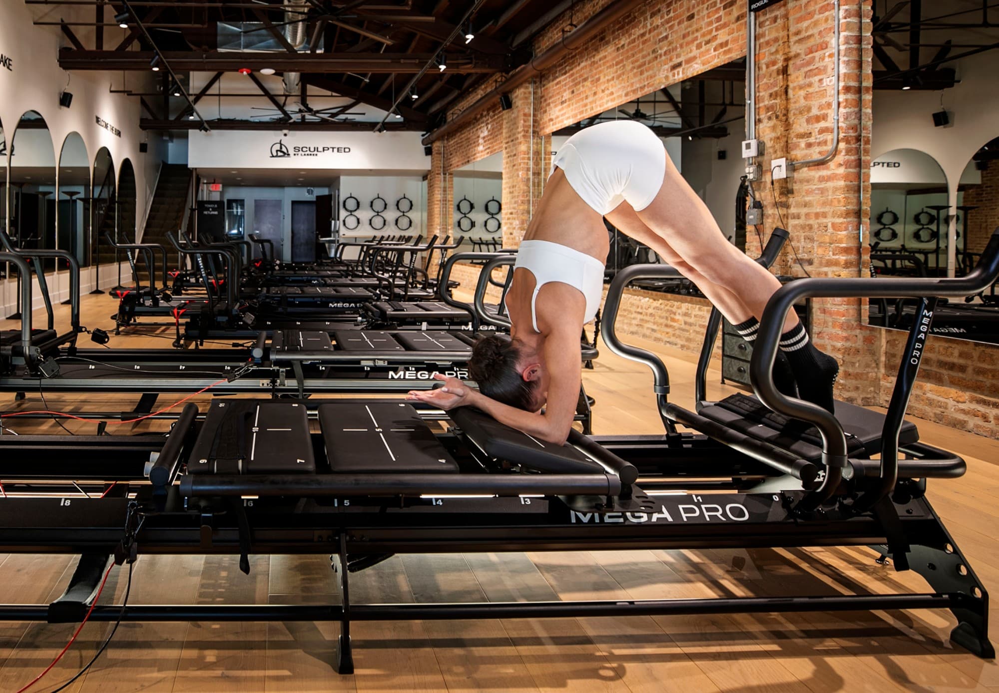 Woman exercising on Lagree machine
